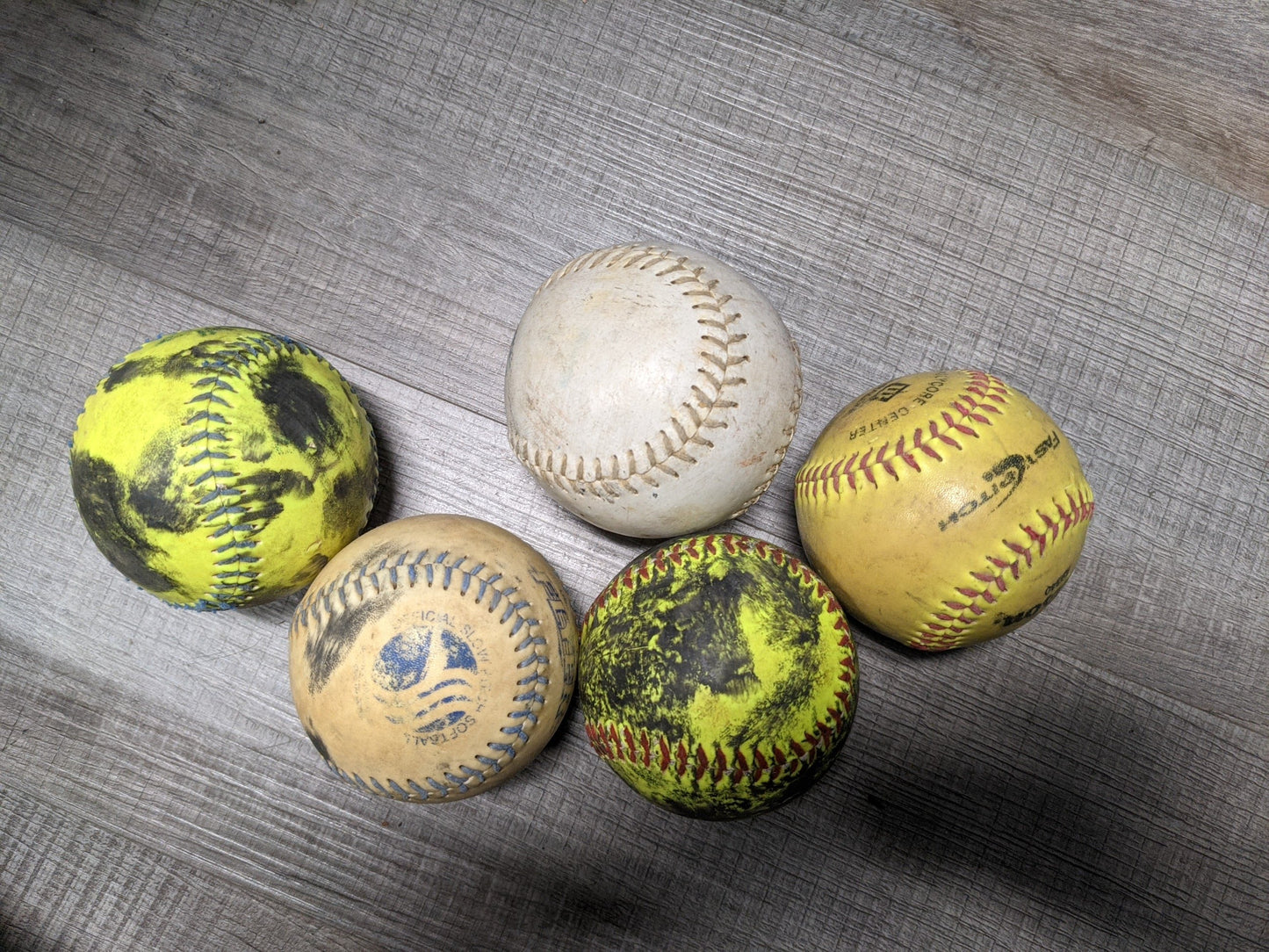 Softballs, Assortment vary, Used.  One Piece.
